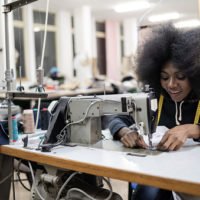 African worker in fashion factory. African worker in fashion factory.